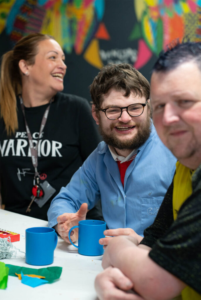 impacd students smiling on coffee break