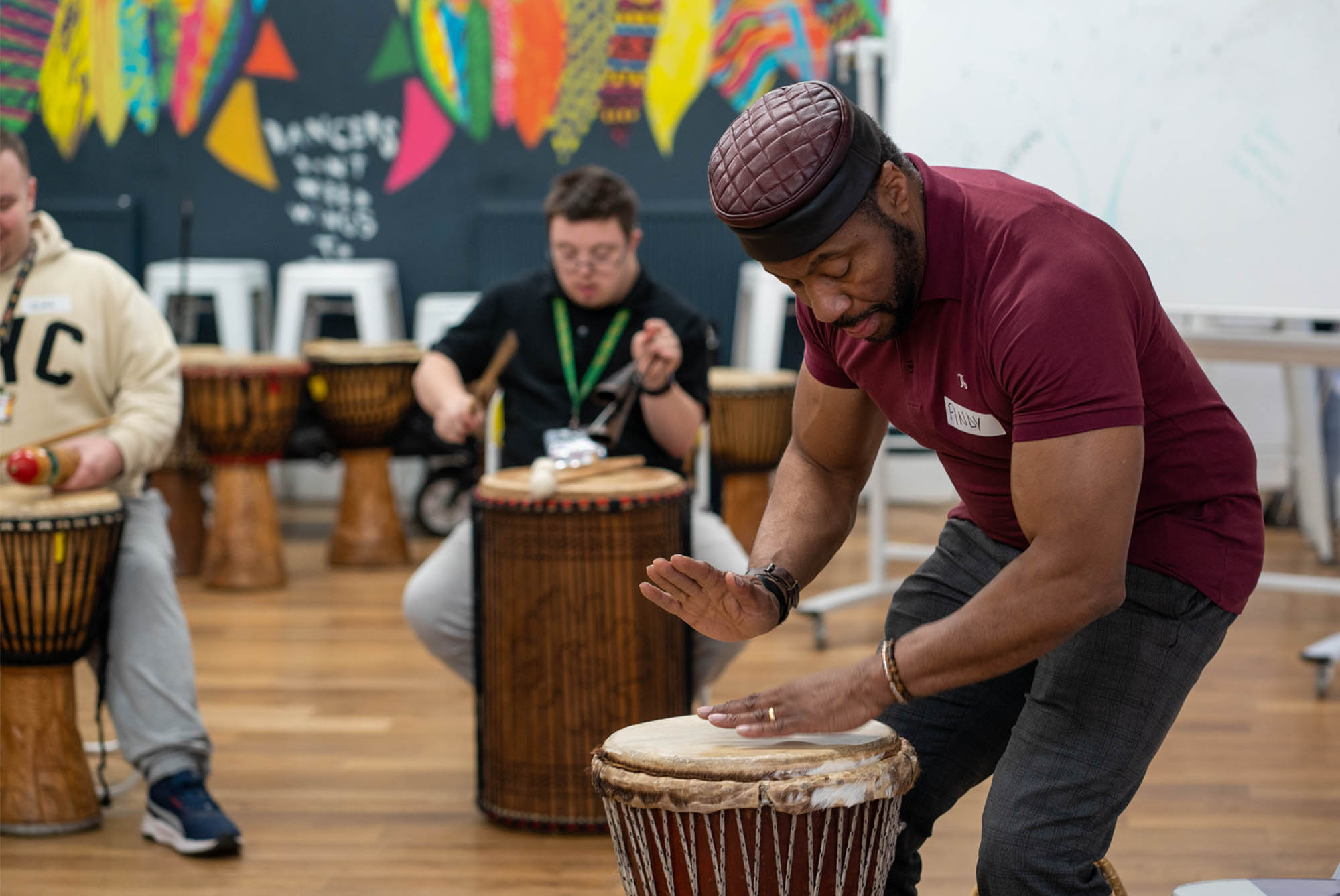 Impacd Teacher Andy leading the drums