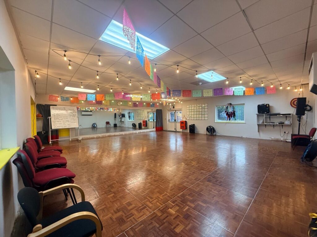 a brightly lit dance studio